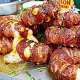 Bacon wrapped onion rings filled with cheese, chili & jalapeno
